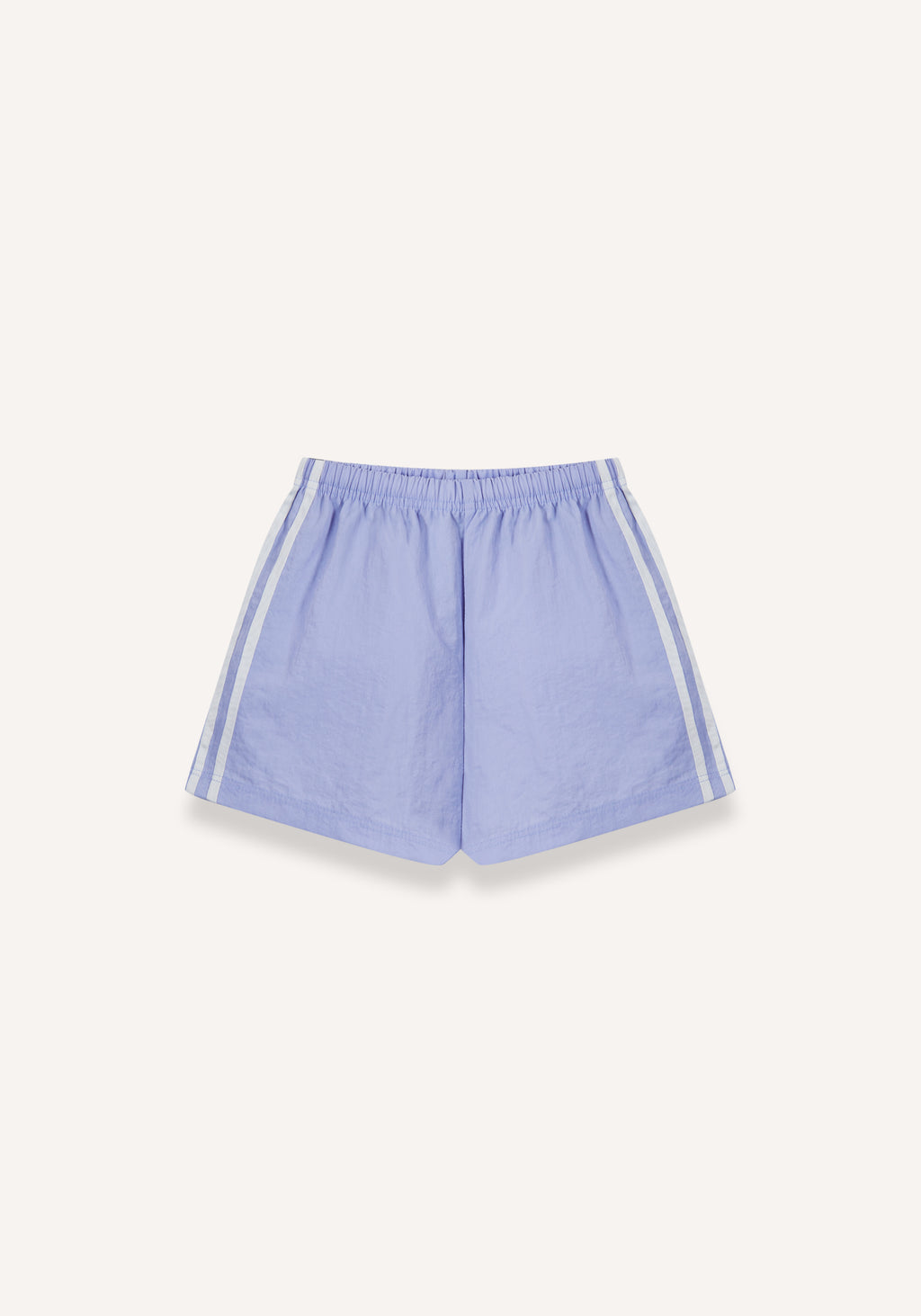 Lilac athletic shorts with white side stripes, displayed flat against a light cream background.