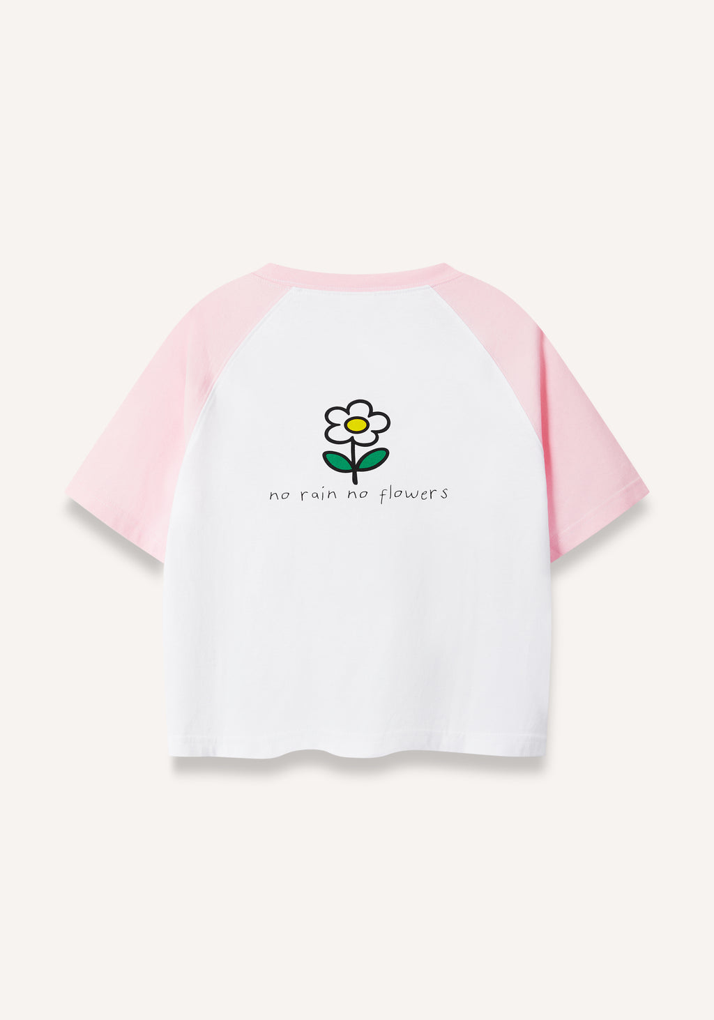 A short-sleeve raglan t-shirt with a white body and light pink sleeves, featuring a small cartoon flower graphic and the text 'no rain no flowers' printed on the chest, shown against a light off-white background.