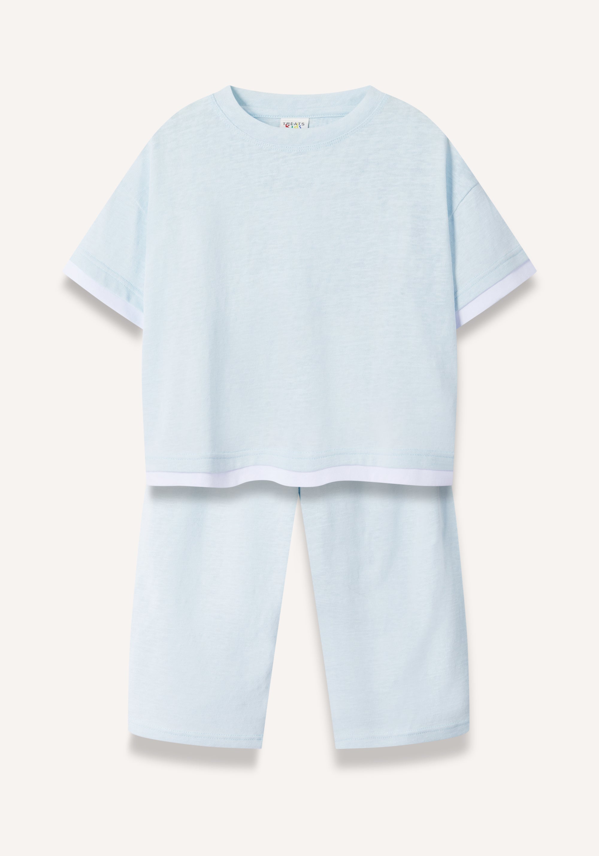 A light blue two-piece pajama set featuring a short-sleeve top with white contrast trim and matching long pants, displayed flat against a light beige background.